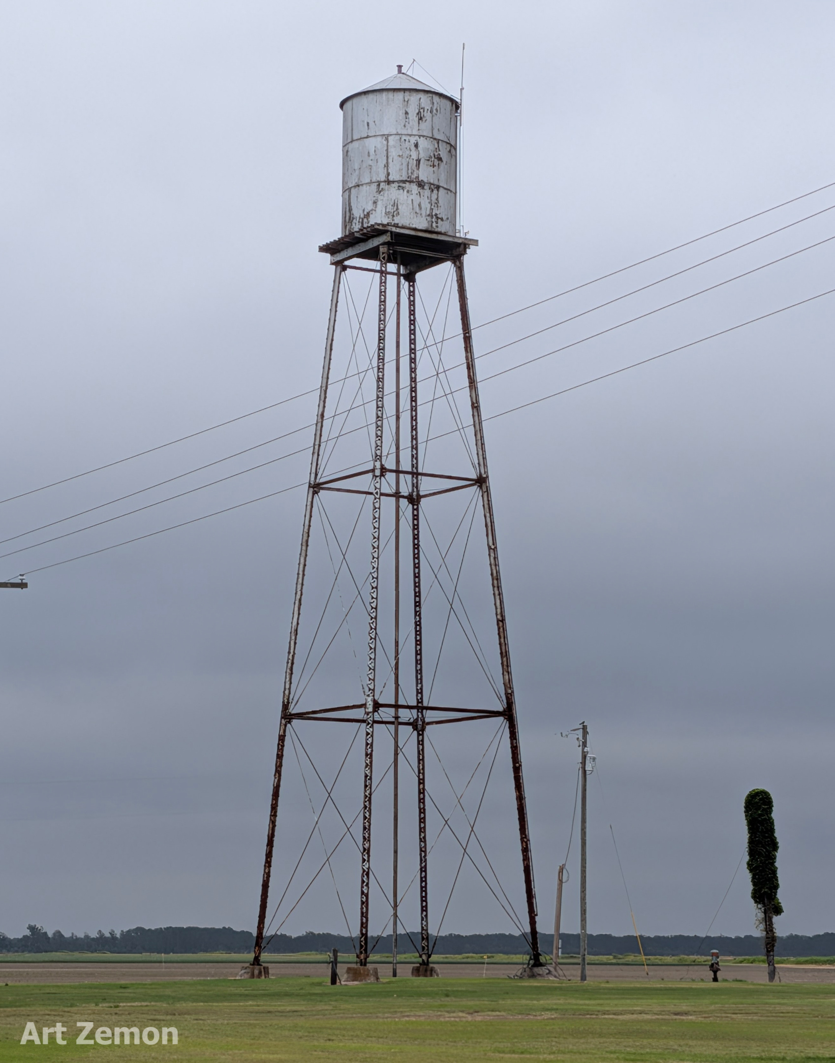 old water tower under overcast skies