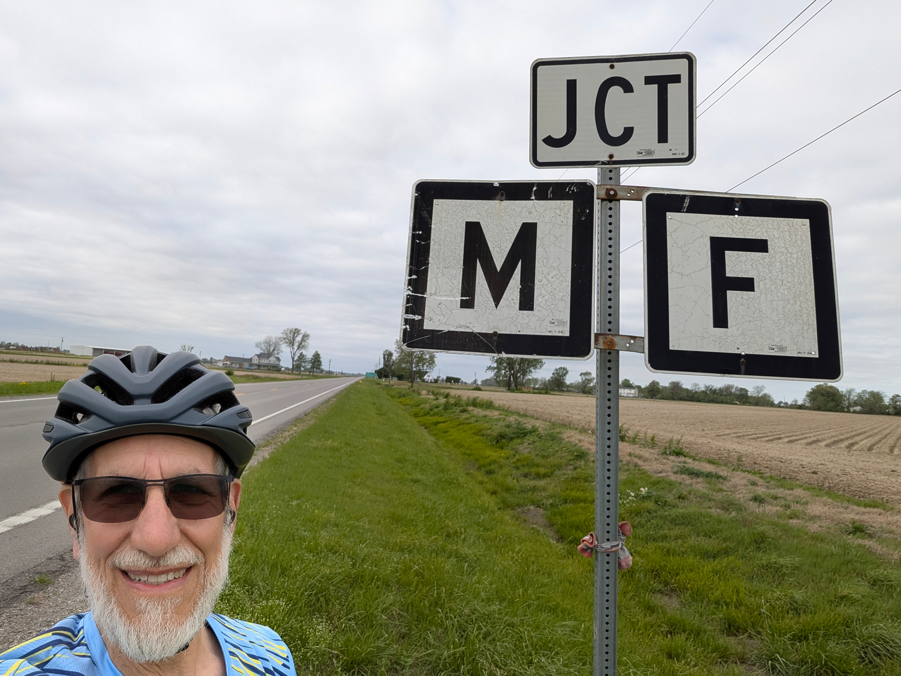 Art Zemon next to signs reading JCT M F