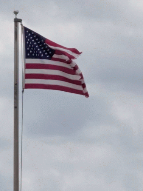 US flag waving in a strong wind