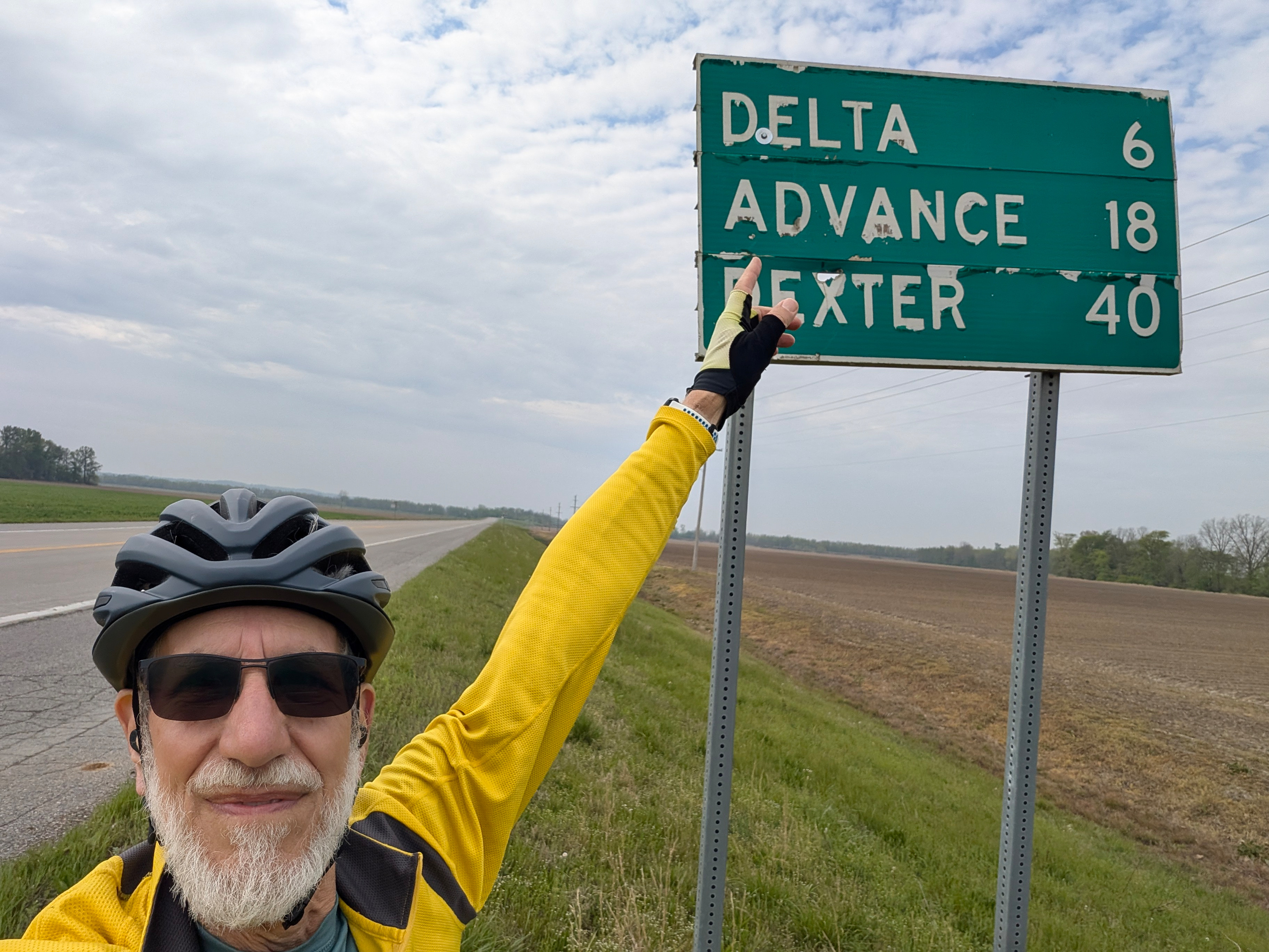 Art Zemon pointing to a sign for Advance, MO