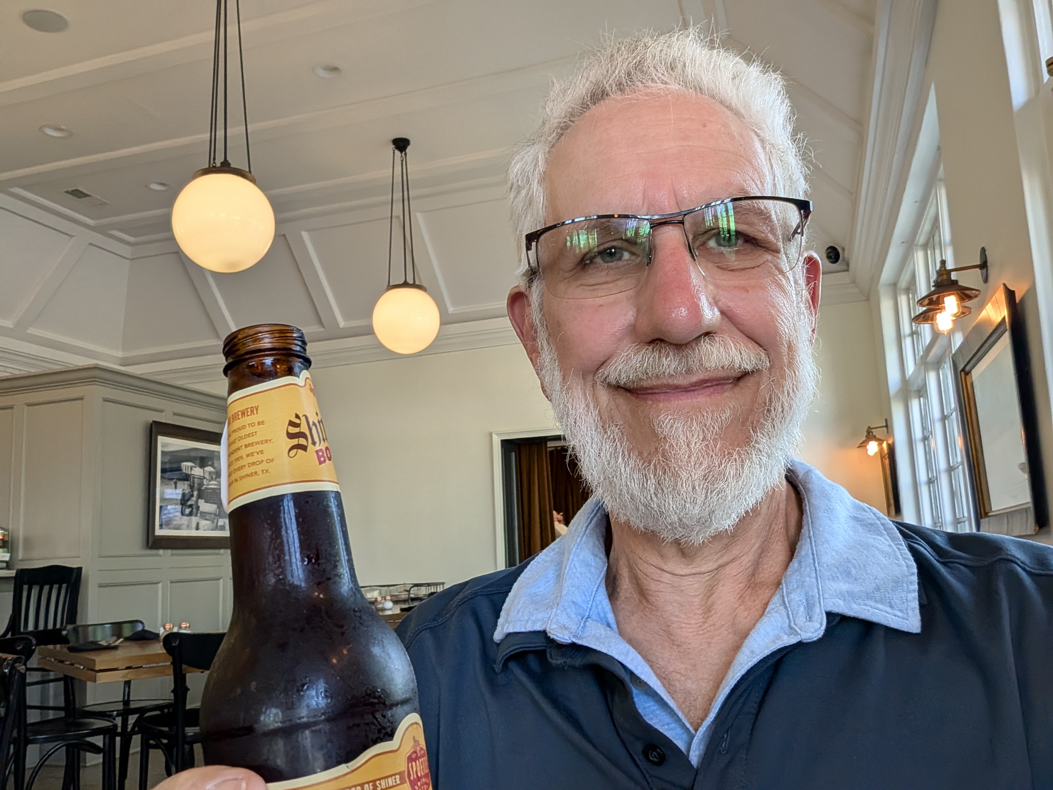 Art Zemon toasting you with a bottle of beer